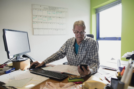Businessman working in an office at home.の写真素材