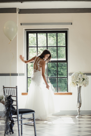 Young bride is having a moment to herself on her wedding day. の写真素材