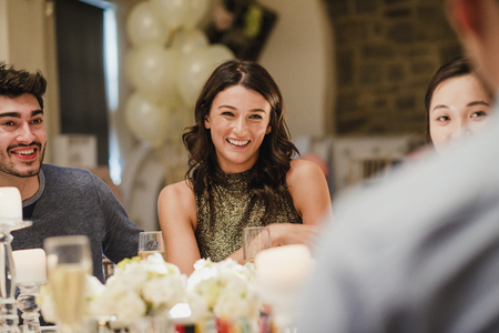 Wedding guests are socialising at the dinner party. の写真素材