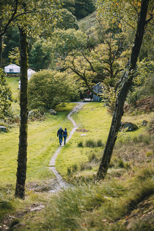 Senior couple have returned back to their campsite after a long hike through the Lake District. の写真素材