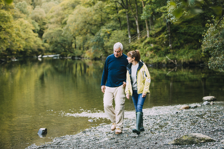 Senior couple are nejoying a walk around the Lake District together.の写真素材