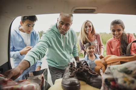 Inside view of car boot as family unpack the car.の写真素材