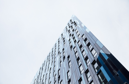 Low angle view of an office building in a city.