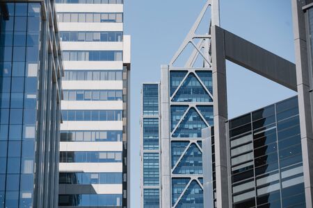 Tops of modern glass skyscrapers in Perth, Australia.