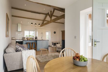 A wide-view shot of a modern living room and kitchen in Northeastern England.の写真素材