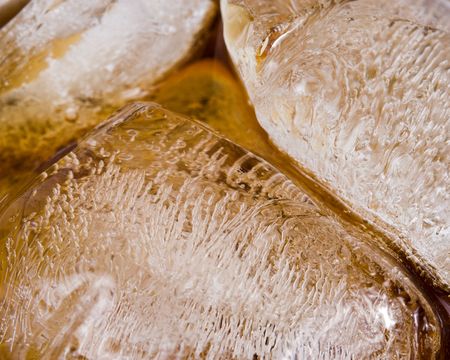 Cold fizzy cola with ice in a glass. Close up. Abstract background.の写真素材
