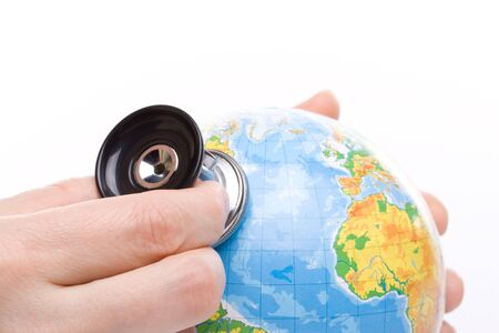 Globe with stethoscope on a white backgroundの写真素材