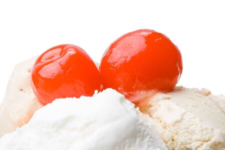 Ice-cream with a cherry in a glass on a white background.の写真素材
