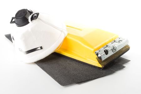 Sandpaper with holder and dust mask on a white backgroundの写真素材