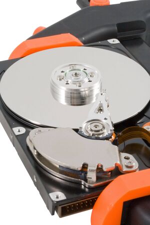 The  hard disk clamped in a manual clamp  on a white background. Concept for data compression.