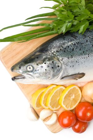 Fresh raw salmon with vegetables on a white backgroundの写真素材