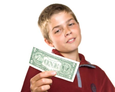 The young boy holds money in handsの写真素材