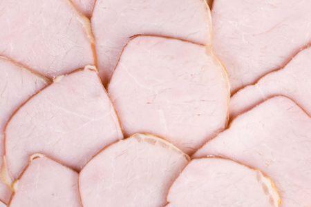 The sausage cut by slices on a dishの写真素材