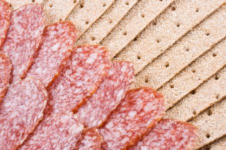 The sausage cut by slices on a dish