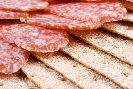 The sausage cut by slices on a dishの写真素材