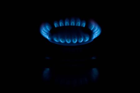 Blue flame of gas on a black backgroundの写真素材