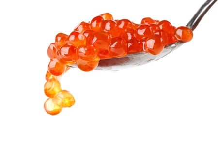 Spoon with red caviar on a white background. Close up.の写真素材