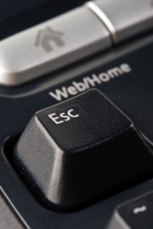 Modern black ergonomic computer keyboard. Close up. Focus on ESC button.の写真素材
