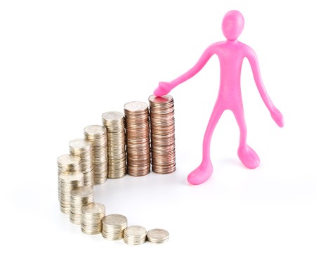 Diagram of growth from coins and plasticine businessmanの写真素材