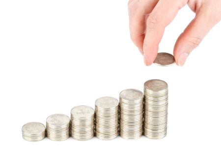 Diagram of growth from coins and hand on a white background