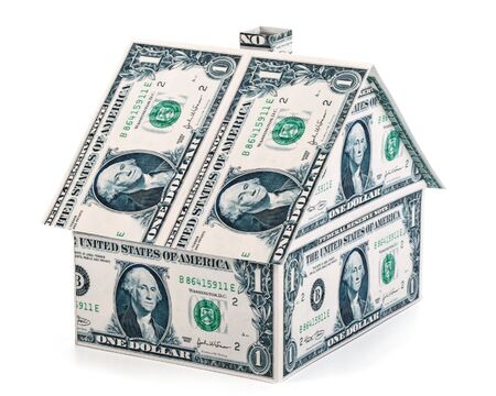 Small house from banknotes on a white backgroundの写真素材