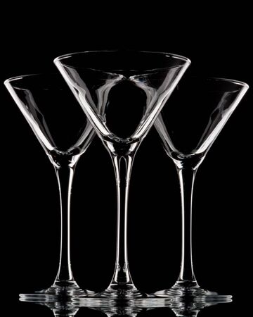 Empty glass for martini on a black background.の写真素材