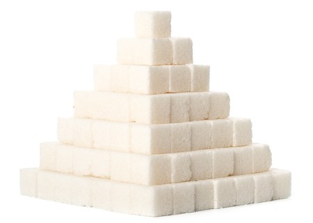 Pyramid from sugar cubes on a white backgroundの写真素材