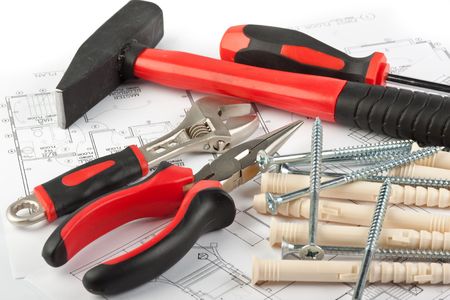 Various construction tools and blueprint of the house