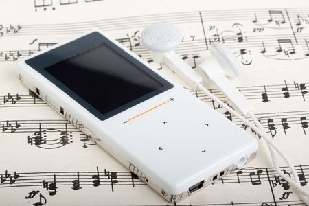 Modern MP3 player and note. Close up.の写真素材