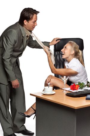Sexual harassment. Pretty businesswoman, draws the employee for its necktie on a white background.の写真素材