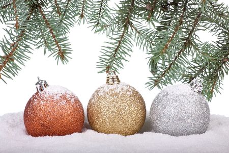 Christmas toy on a snow over white backgroundの写真素材