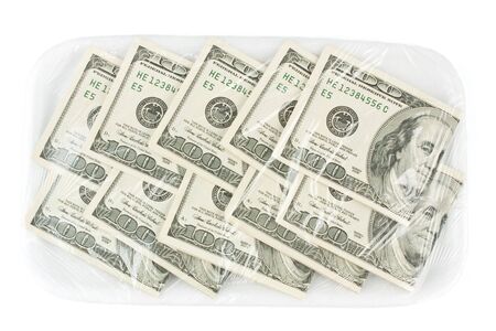 One hundred dollars banknotes on a tray