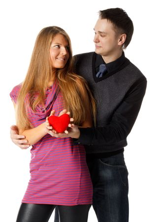 Young enamoured couple with a heart on a white background.の写真素材