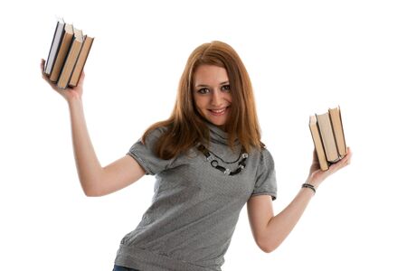The attractive student stands with books on a white background. The student.の写真素材