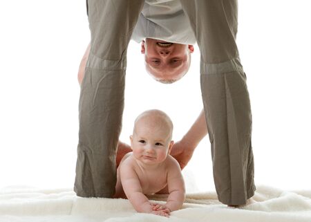 Happy family. Father and  his sweet  baby on a white background.の写真素材