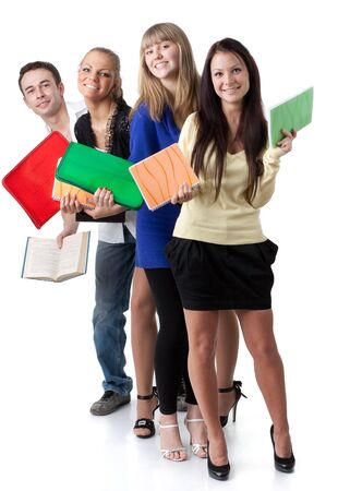Group of young cheerful people with writing-books on a white background. Students.の写真素材