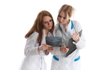Young female doctors with X-ray  image on a white background.の写真素材