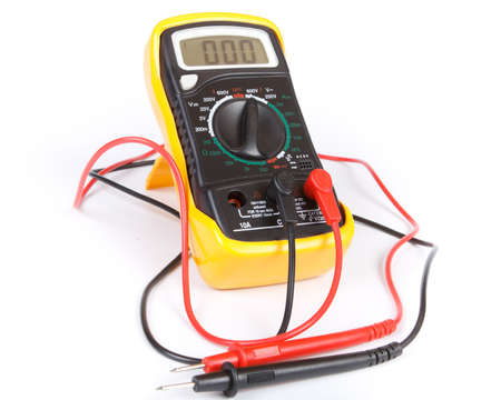 Digital yellow multimeter on a white background.