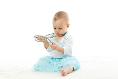 Sweet baby with stethoscope on a  white background の写真素材