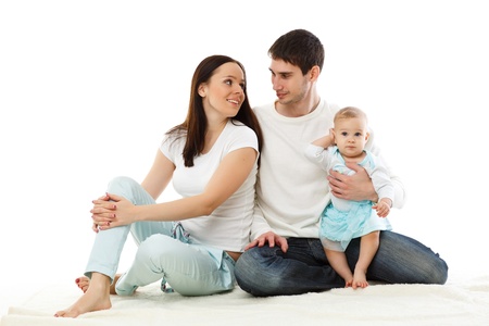 Young parents with their  sweet  baby on a white background  Happy family 