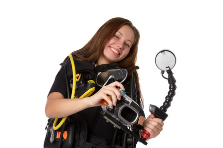Beautiful woman scuba diver  with photocamera on a white background.の写真素材