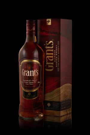 Bottle of Grant's whisky on a black background with reflection.のeditorial素材