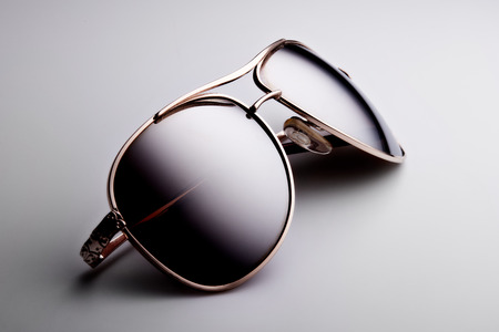 Sunglasses isolated on a white background. Classic design. Protection of eyes against the UV radiation of the sunの写真素材