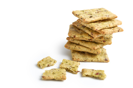 Tasty diet cerel crispbread with seeds and spices: heap of whole  crackers and one broken isolated on a white background with copy space.の写真素材