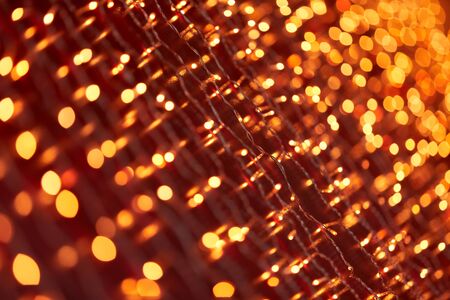 Festive background with LED lights garland. Christmas and New Year background. Blurred bokeh from the lights of a garland.の写真素材