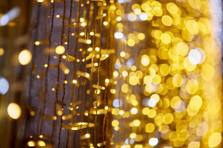 Festive background with LED lights garland. Blurred bokeh from the lights of a garland.