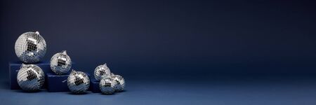 Abstract composition with blue geometrical figures and mirorr balls on dark blue background with copy space. For design of advertising,  web design. Christmas and New Yearの写真素材