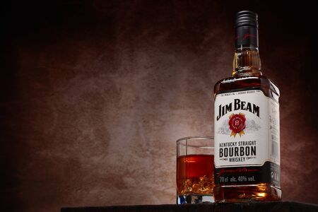 St.Petersburg, Russia - December 2019 - Bottle of Jim Beam bourbon whiskey and glass with drink and...