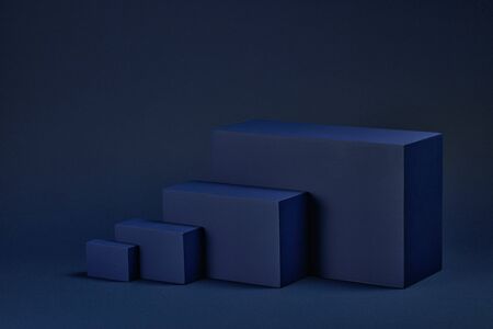 Abstract composition with geometric figures. Set of rectangular parallelepipedes on a blue background. Abstract background with copy space for design of advertising, engineering draft, web design.の写真素材