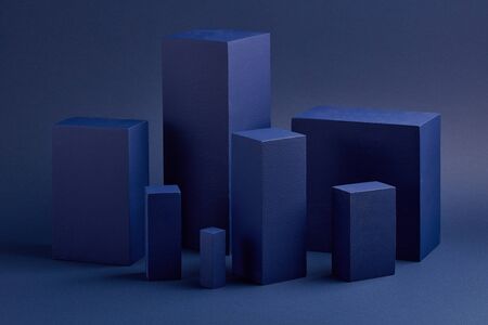 Abstract composition with geometric figures. Set of rectangular parallelepipedes on a blue background. Abstract background with copy space for design of advertising, engineering draft, web design.の写真素材